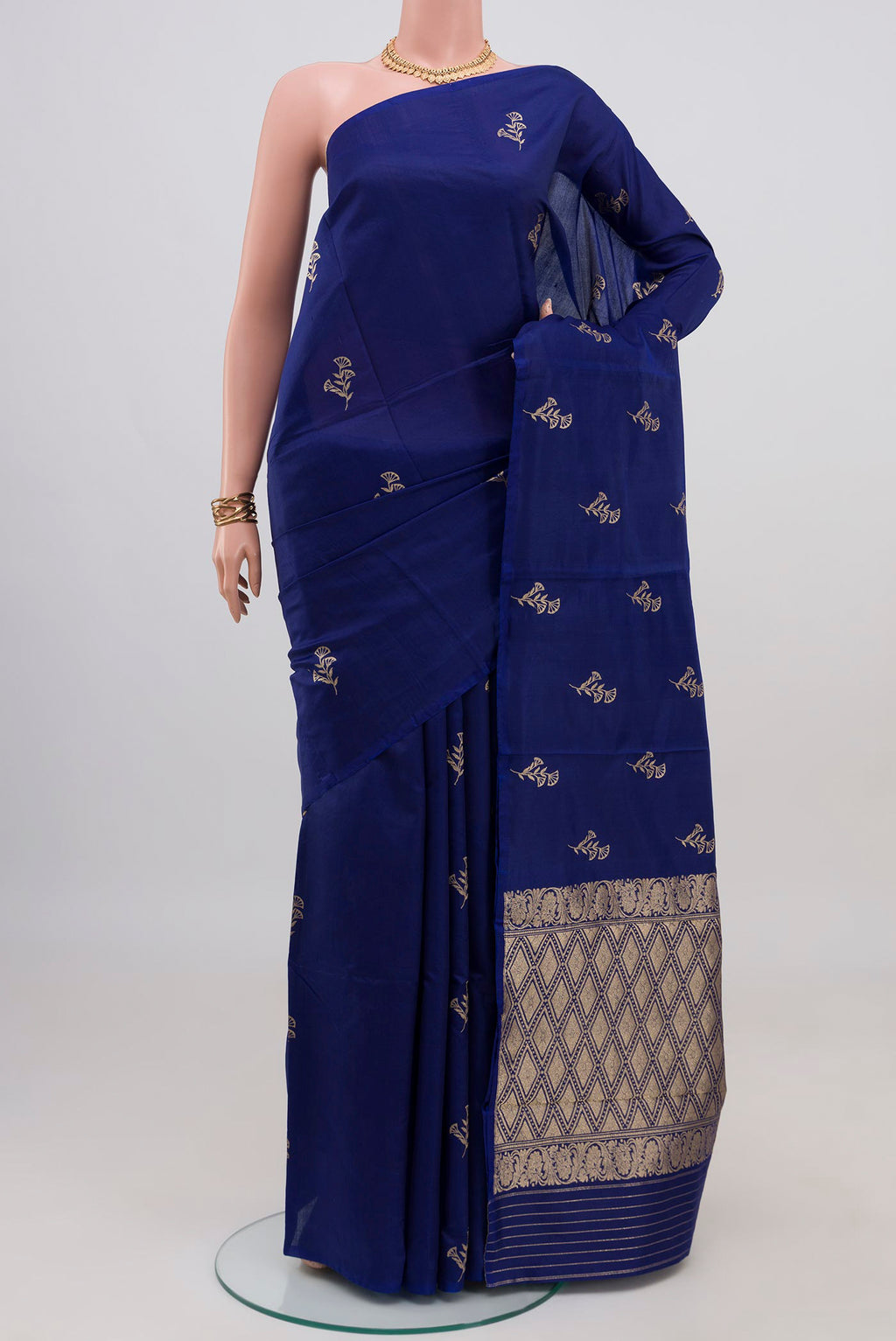 Blue Banarasi Katan Silk Saree with Zari Butta on the body and Without Border.  displayed on a mannequin
