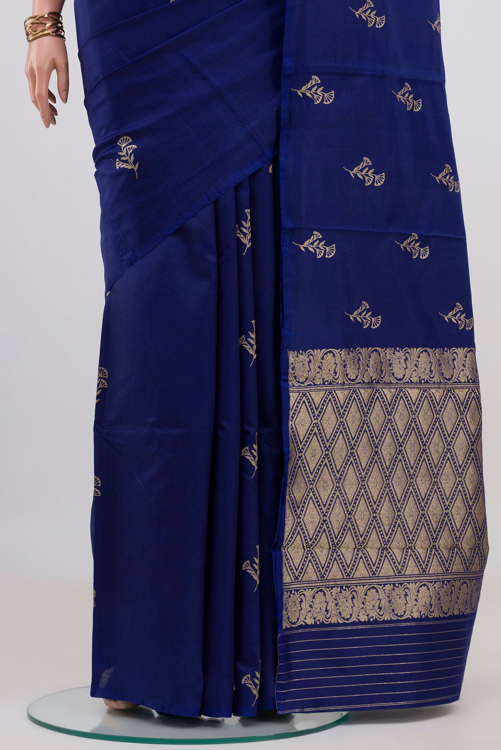 Pleats and pallu of Blue Banarasi Katan Silk Saree with Zari Butta on the body and Without Border. 