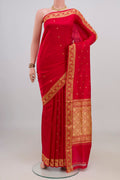 Pure Silk Red Banarasi Katan Saree with Thread Butta on the body and Thread Border.  displayed on a mannequin