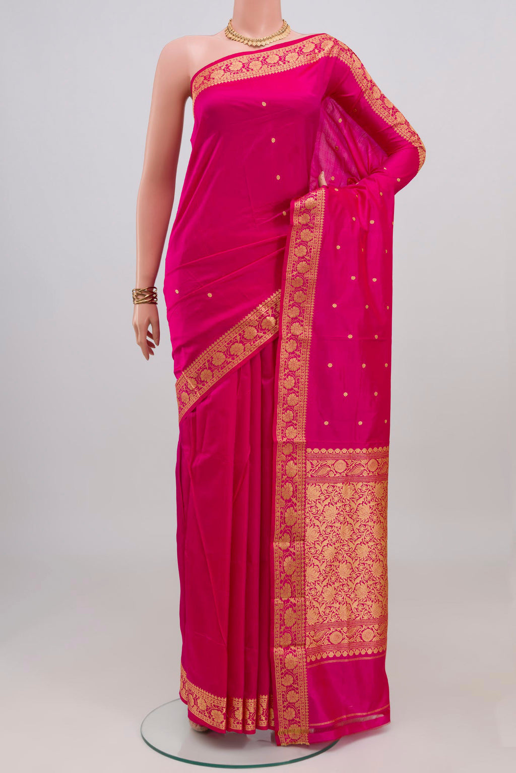 Pink Banarasi Katan Silk Saree with Thread Butta on the body and Thread Border.  displayed on a mannequin