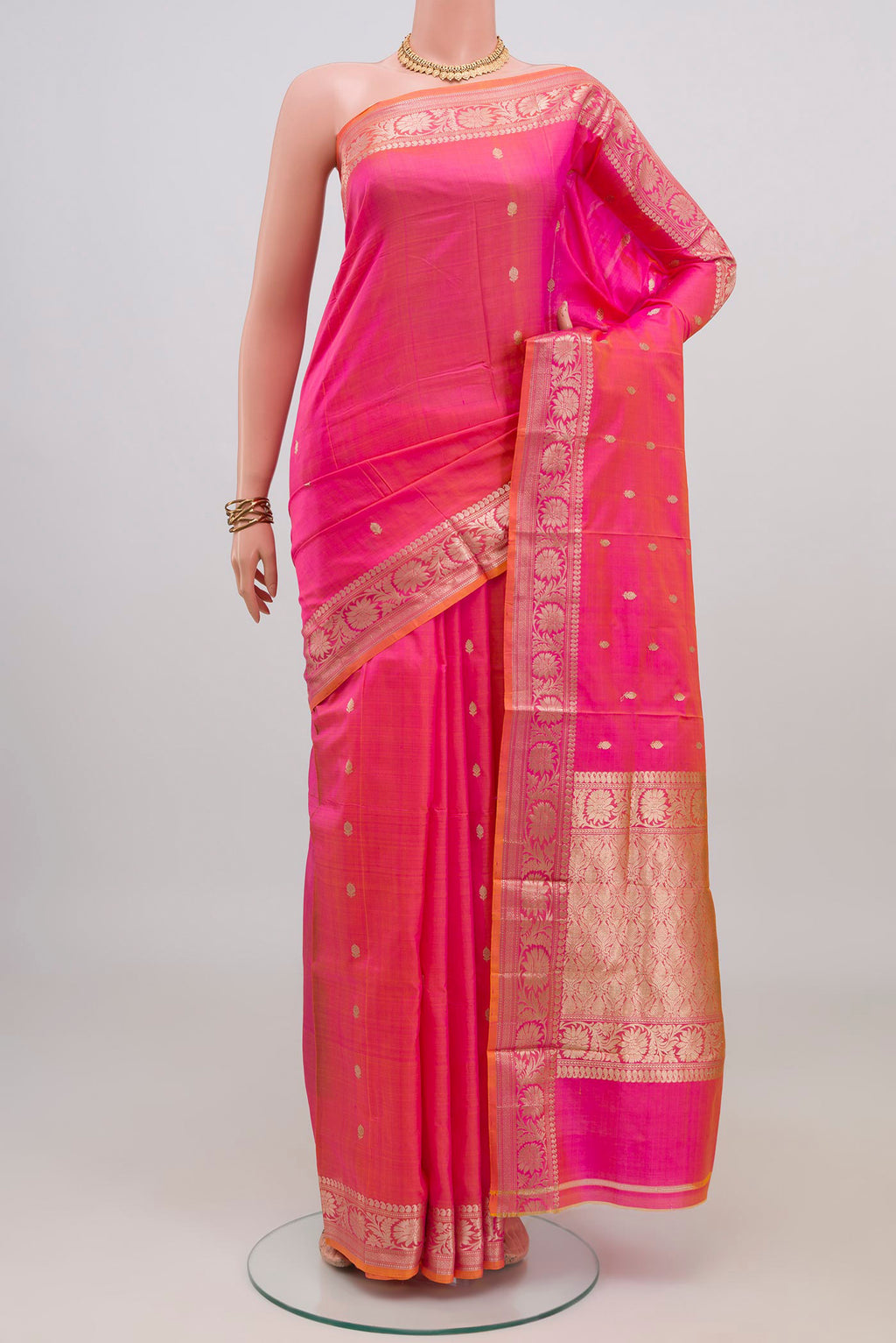 Pink Banarasi Katan Silk Saree with Zari Butta on the body and Zari Border.  displayed on a mannequin
