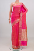 Pink Banarasi Katan Silk Saree with Zari Butta on the body and Zari Border.  displayed on a mannequin