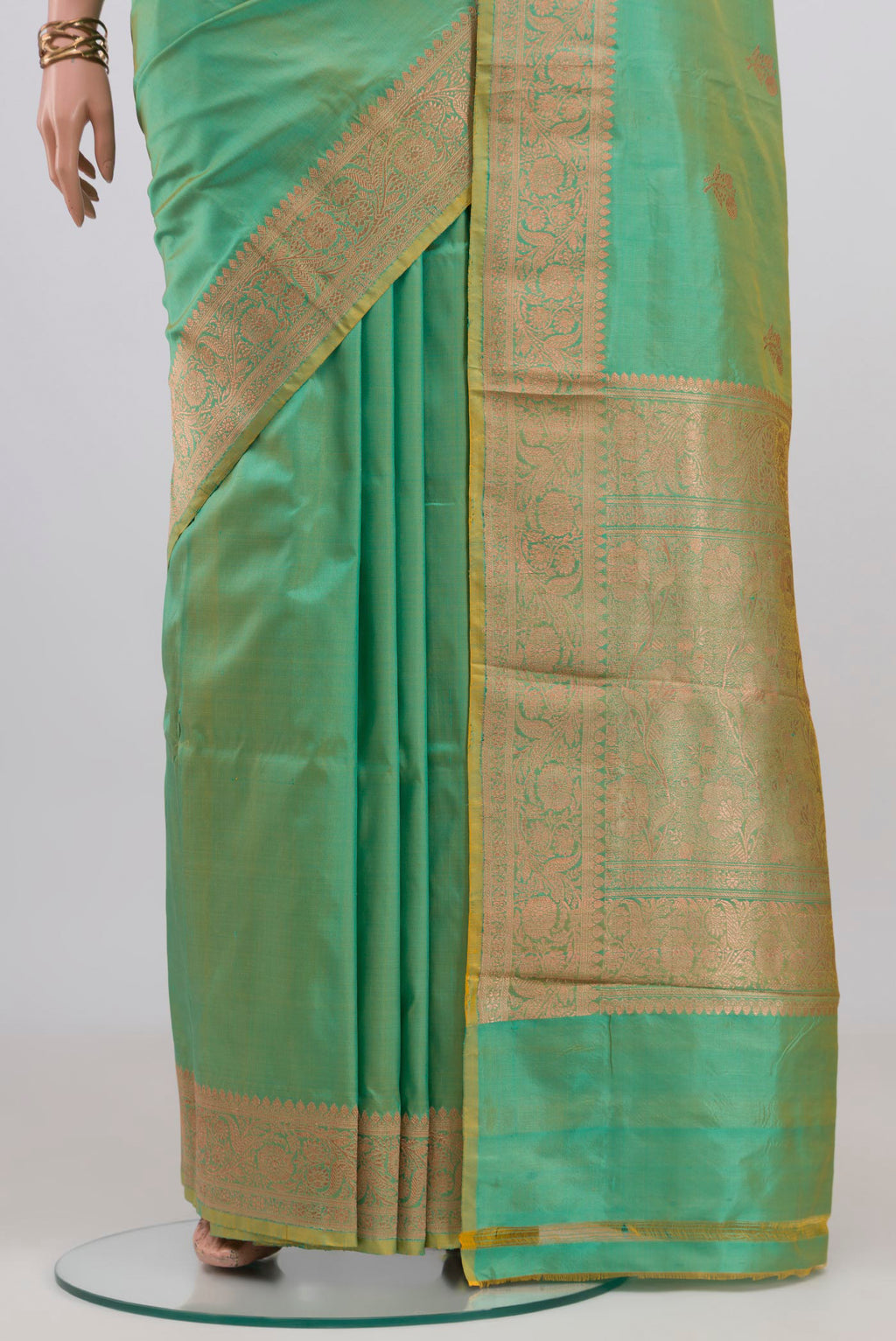 Pleats and pallu of Sea Green Banarasi Katan Silk Saree with Zari Butta on the body and Zari Border. 