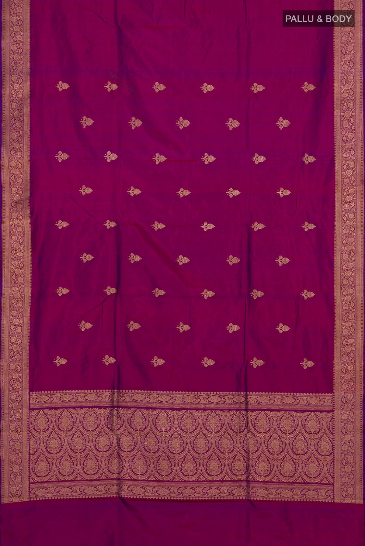 Flat view of Magenta Banarasi Katan Silk Saree with Zari Butta on the body and Zari Border. 