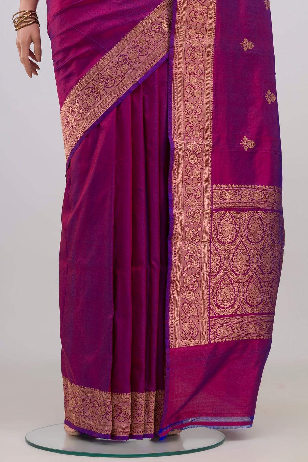 Pleats and pallu of Magenta Banarasi Katan Silk Saree with Zari Butta on the body and Zari Border. 