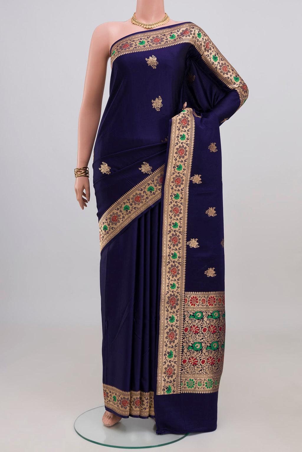 Navy Blue Banarasi Katan Silk Saree with Zari Butta on the body and Zari Border.  displayed on a mannequin