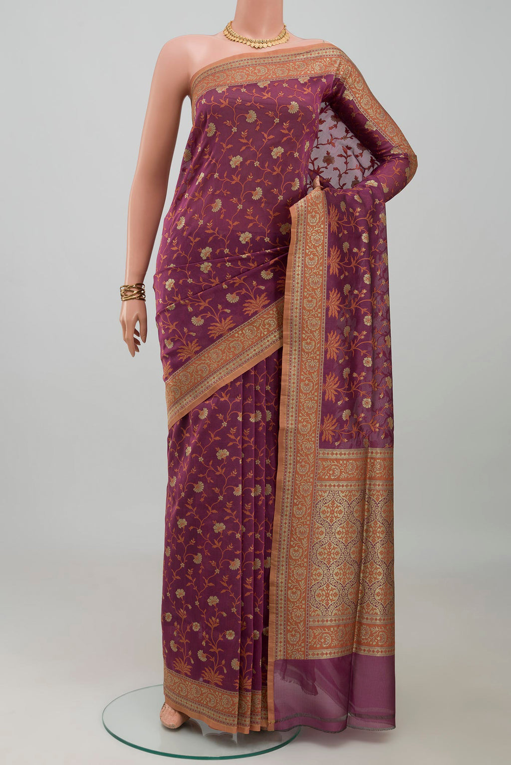 Mauve Banarasi Silk Saree with Zari And Thread Butta on the body and Zari Border.  displayed on a mannequin