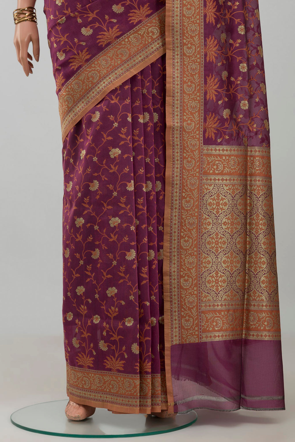 Pleats and pallu of Mauve Banarasi Silk Saree with Zari And Thread Butta on the body and Zari Border. 