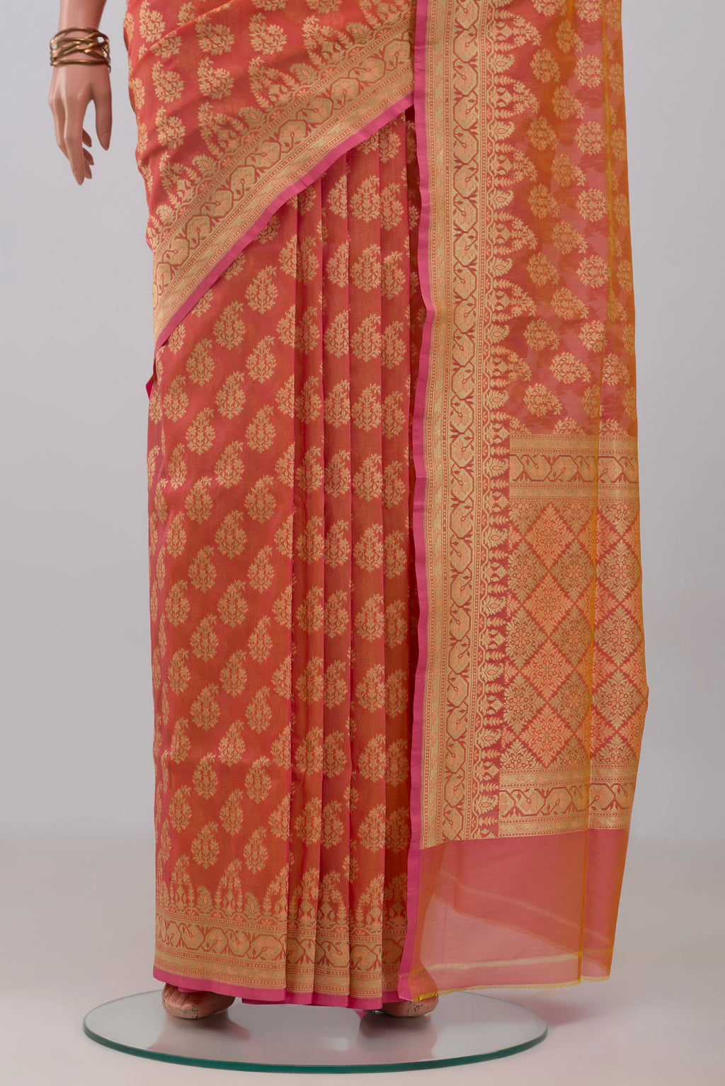 Pleats and pallu of Peach Banarasi Silk Saree with Zari Butta on the body and Zari Border. 