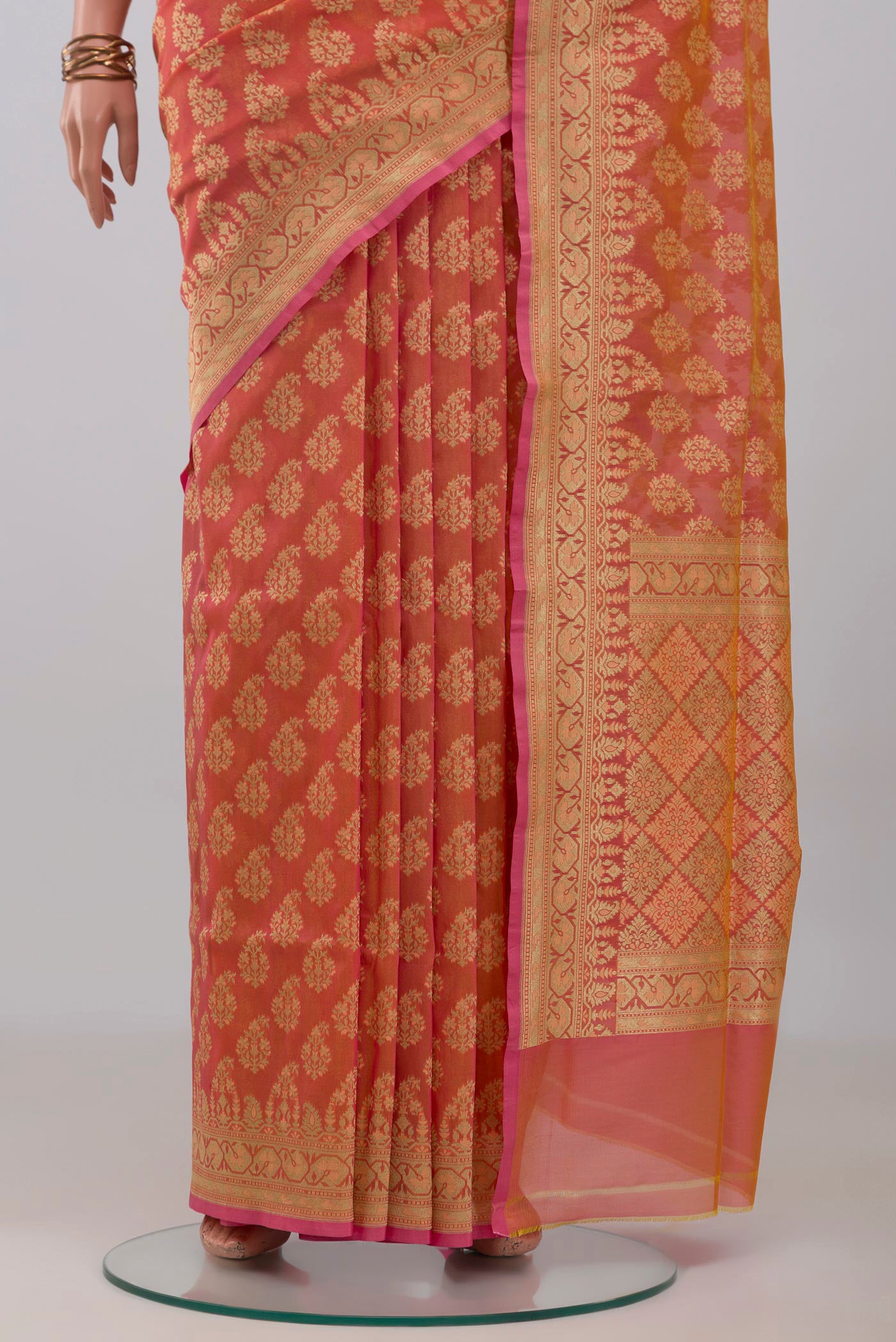 Pleats and pallu of Peach Banarasi Silk Saree with Zari Butta on the body and Zari Border. 