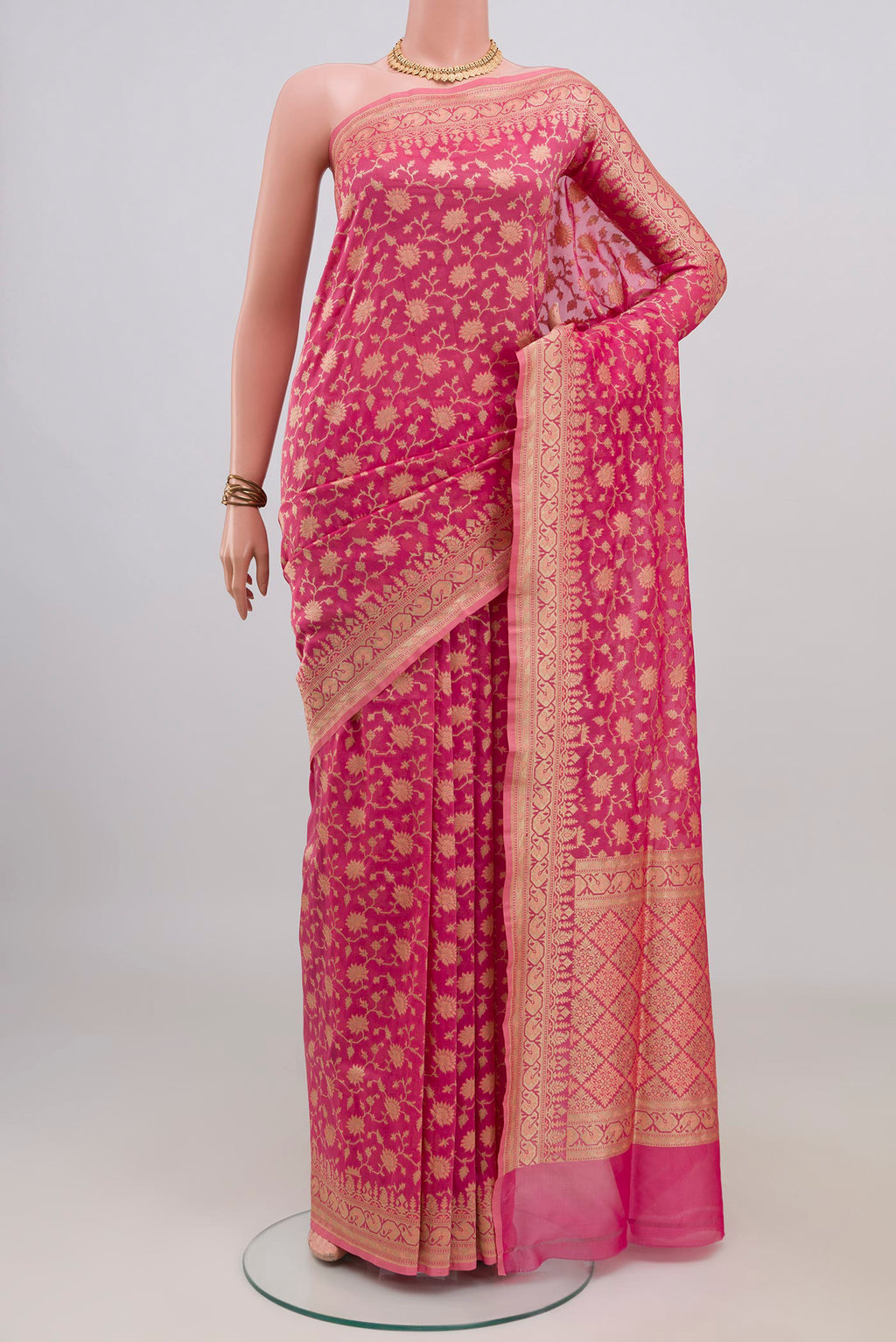 Pure Silk Rose pink Banarasi Saree with Zari And Thread Butta on the body and Zari Border.  displayed on a mannequin