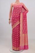 Pure Silk Rose pink Banarasi Saree with Zari And Thread Butta on the body and Zari Border.  displayed on a mannequin