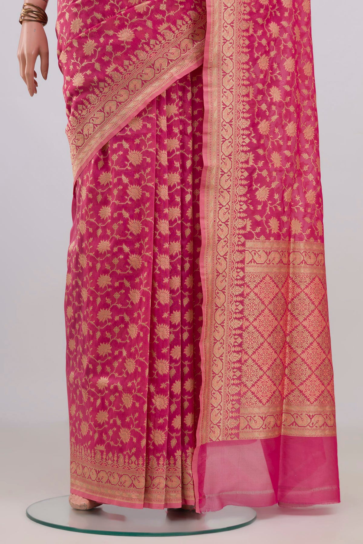 Pleats and pallu of Pure Silk Rose pink Banarasi Saree with Zari And Thread Butta on the body and Zari Border. 