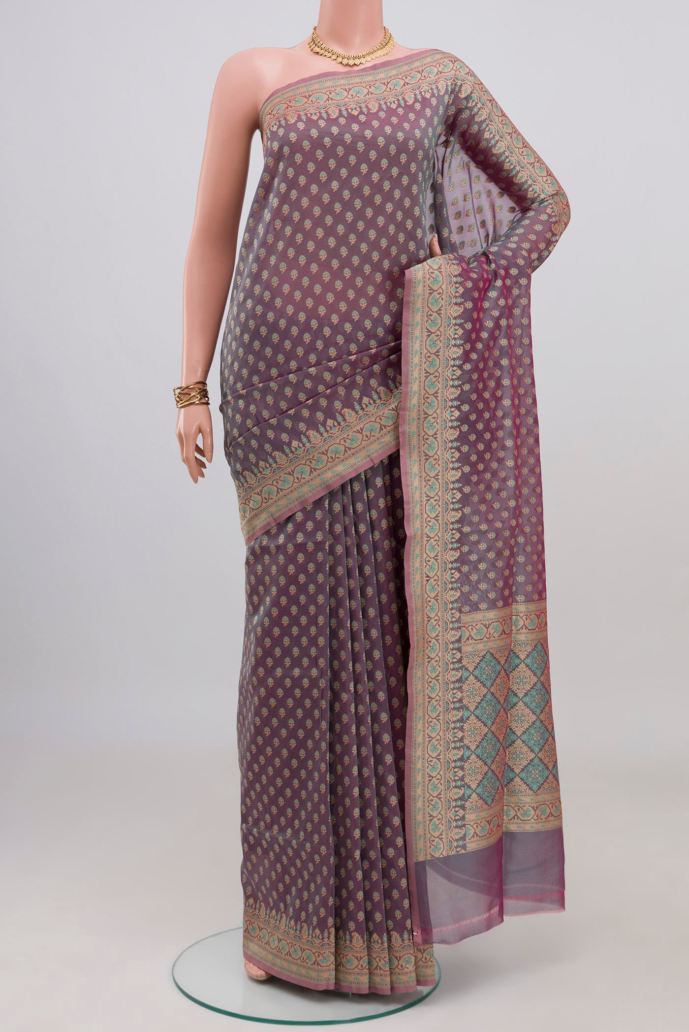 Lavender Banarasi Silk Saree with Zari Butta on the body and Zari Border.  displayed on a mannequin