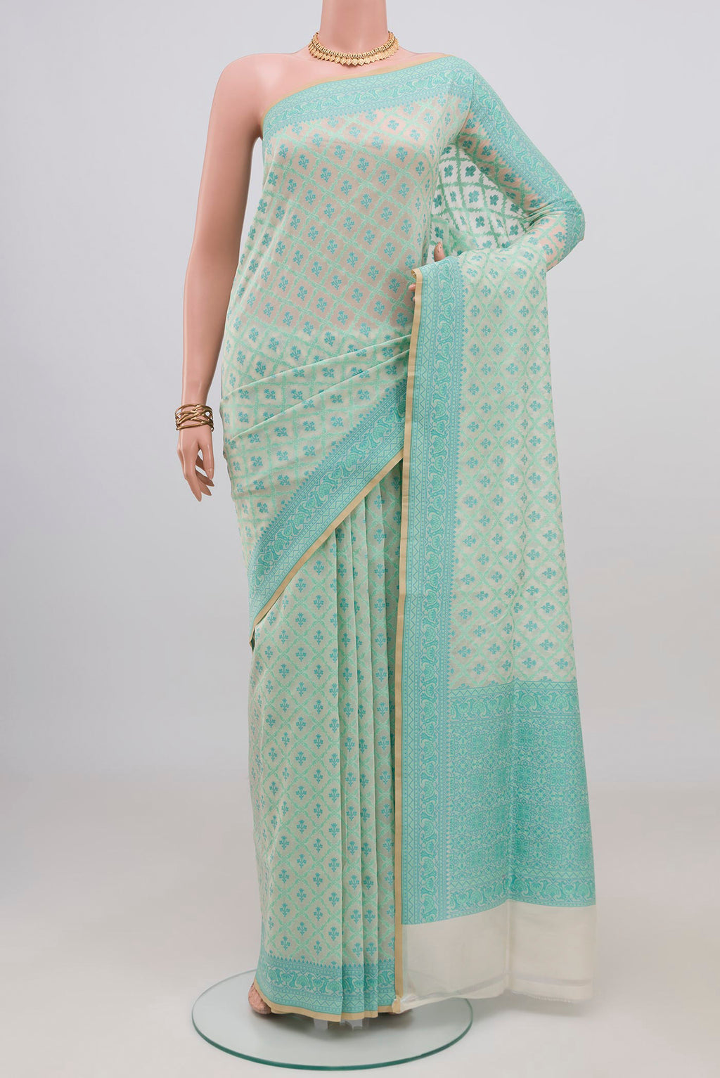 Cream Banarasi Silk Saree with Thread Butta on the body and Thread Border.  displayed on a mannequin
