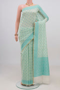 Cream Banarasi Silk Saree with Thread Butta on the body and Thread Border.  displayed on a mannequin