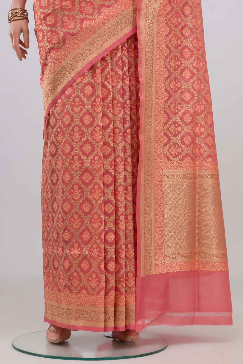 Pleats and pallu of Peach Banarasi Silk Saree with Thread Butta on the body and Zari Border. 