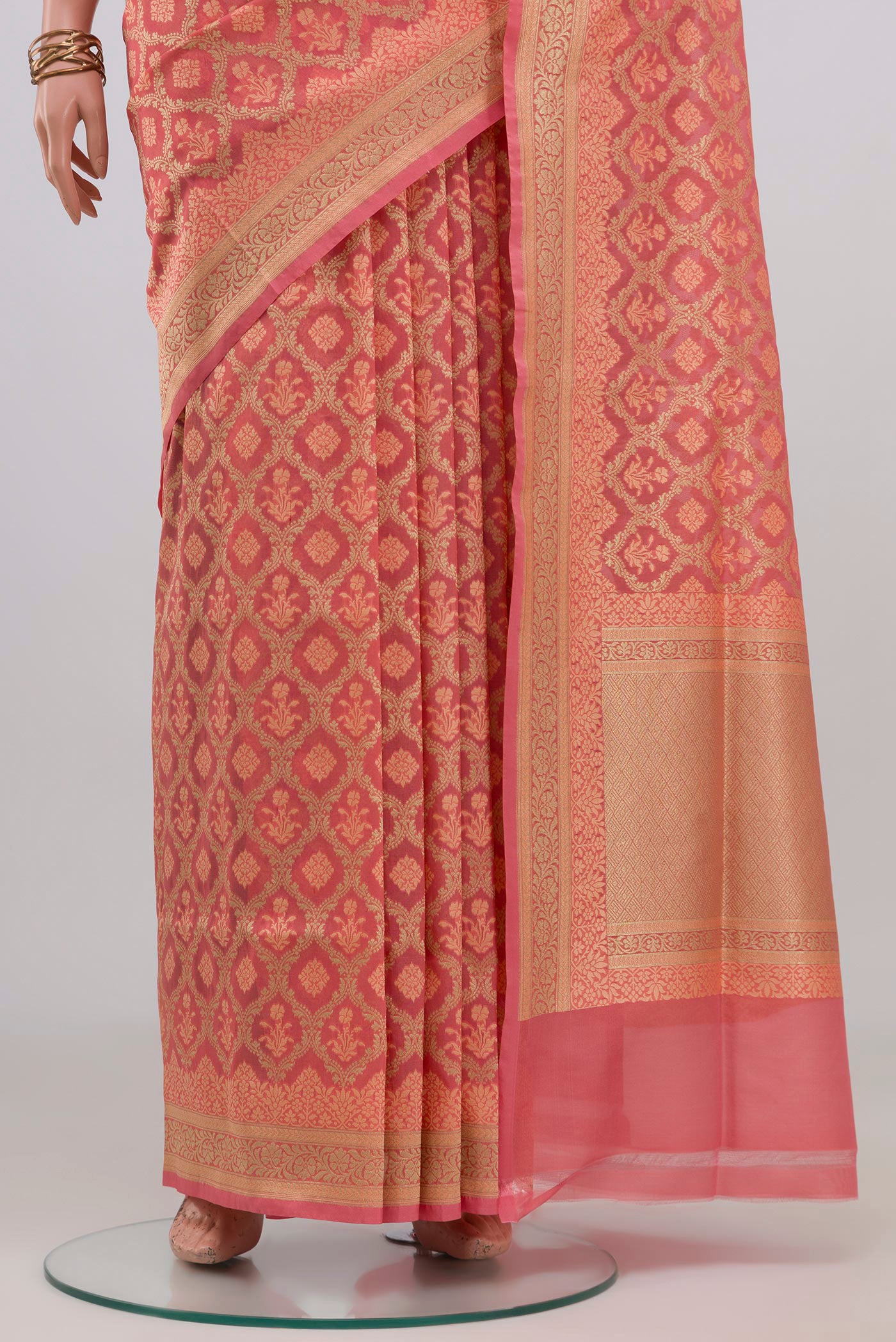 Pleats and pallu of Peach Banarasi Silk Saree with Thread Butta on the body and Zari Border. 