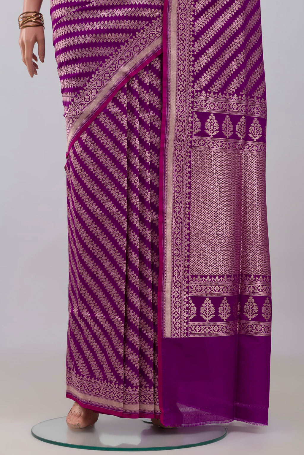 Pleats and pallu of Purple Banarasi Silk Saree with Zari Butta on the body and Zari Border. 