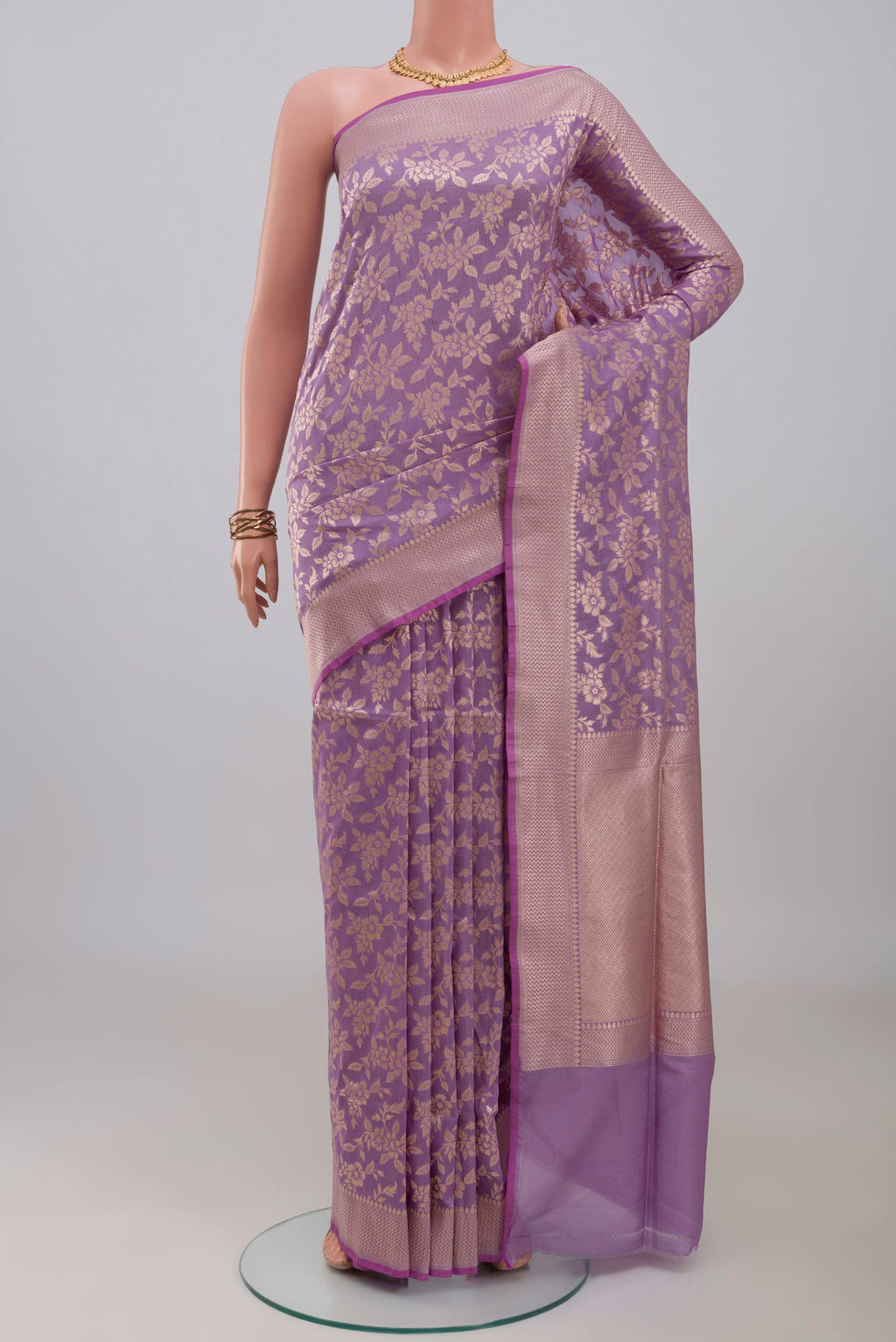 Lavender Banarasi Silk Saree with Zari Butta on the body and Zari Border.  displayed on a mannequin