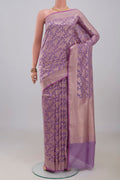 Lavender Banarasi Silk Saree with Zari Butta on the body and Zari Border.  displayed on a mannequin