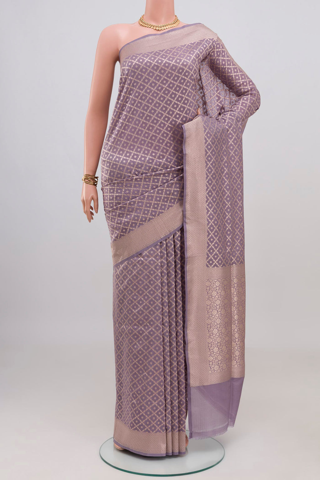 Lavender Banarasi Silk Saree with Zari Brocade on the body and Zari Border.  displayed on a mannequin