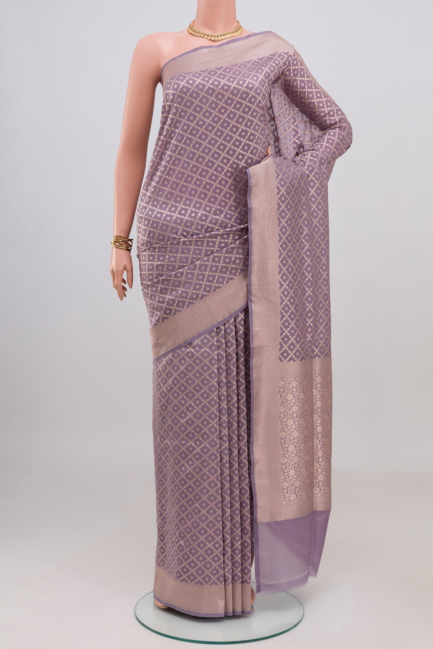 Lavender Banarasi Silk Saree with Zari Brocade on the body and Zari Border.  displayed on a mannequin