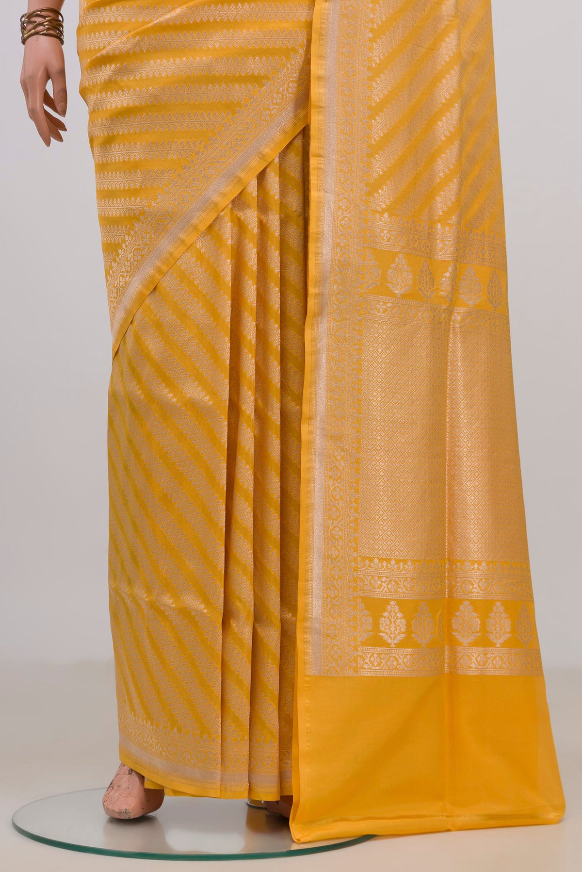 Pleats and pallu of Pure Silk Yellow Banarasi Saree with Zari Brocade on the body and Fancy Border. 