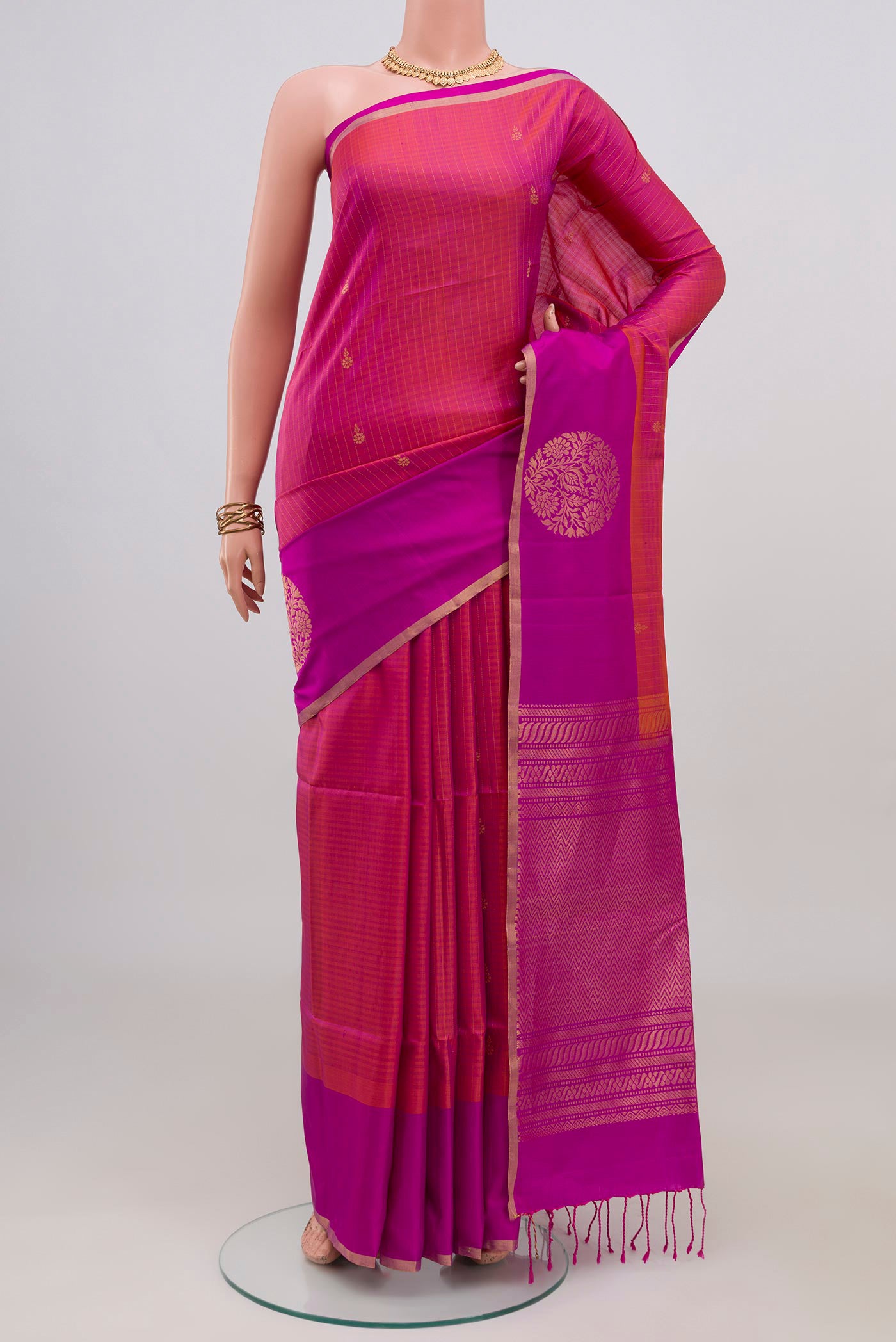 Pink Soft Silk Saree with Checked design on the body and Fancy Border.  displayed on a mannequin
