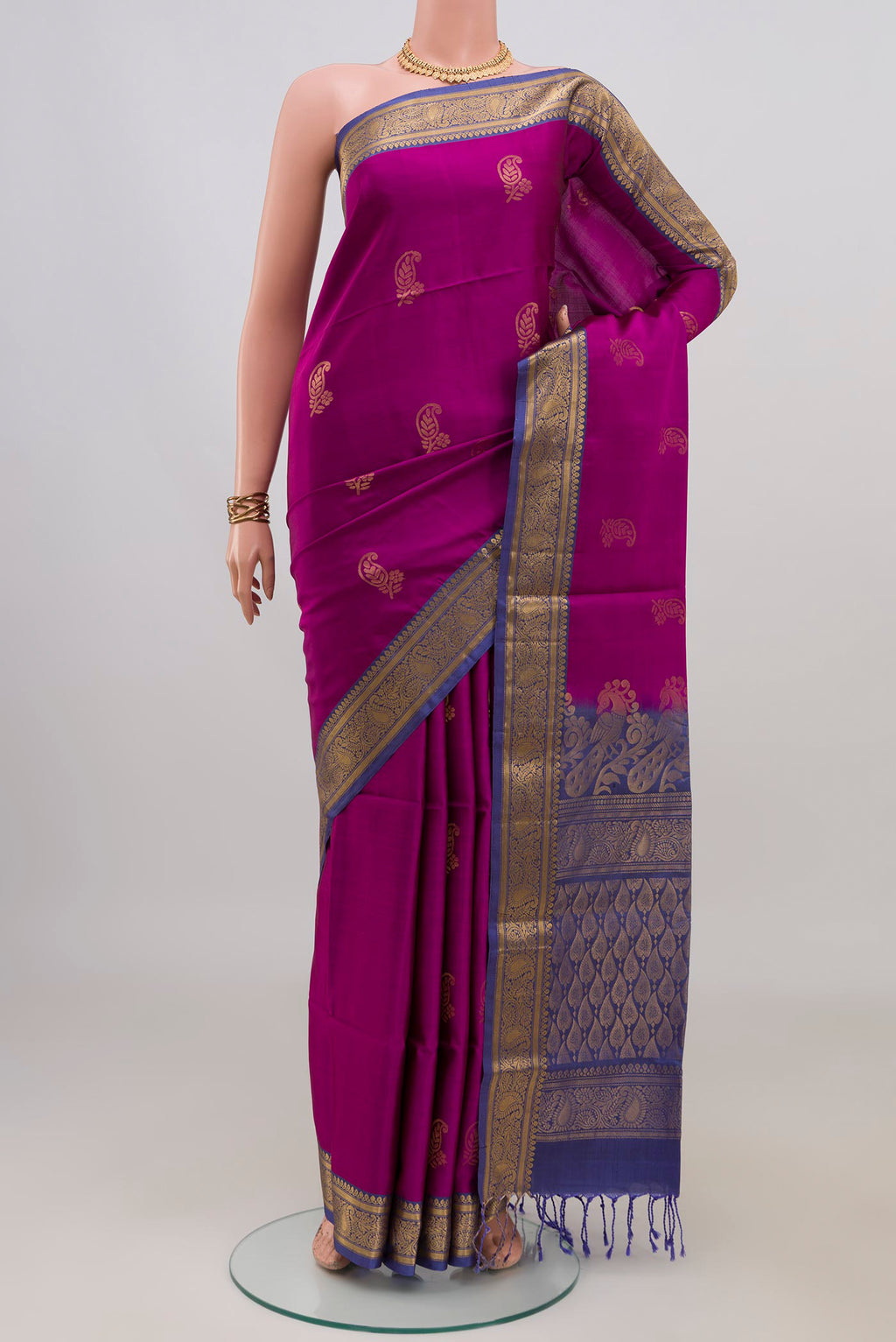 Pure Silk Magenta Soft Saree with Zari Butta on the body and Zari Border.  displayed on a mannequin