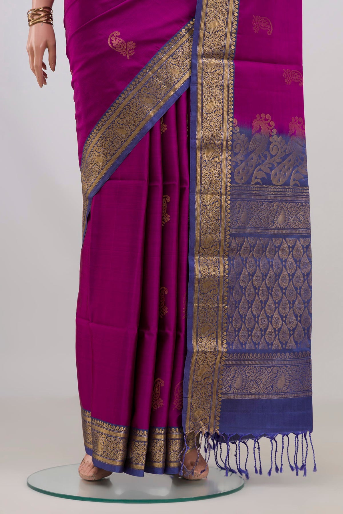 Pleats and pallu of Pure Silk Magenta Soft Saree with Zari Butta on the body and Zari Border. 