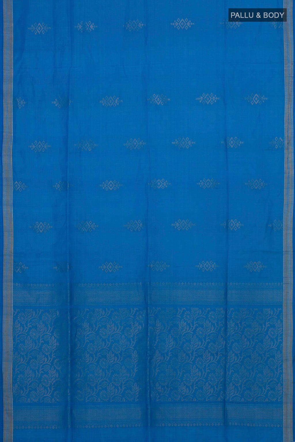Flat view of Pure Silk Blue Soft Saree with Zari Butta on the body and Thin Zari Line. 