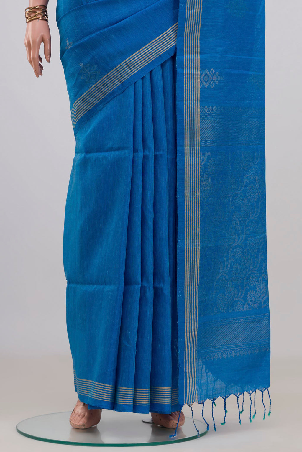 Pleats and pallu of Pure Silk Blue Soft Saree with Zari Butta on the body and Thin Zari Line. 