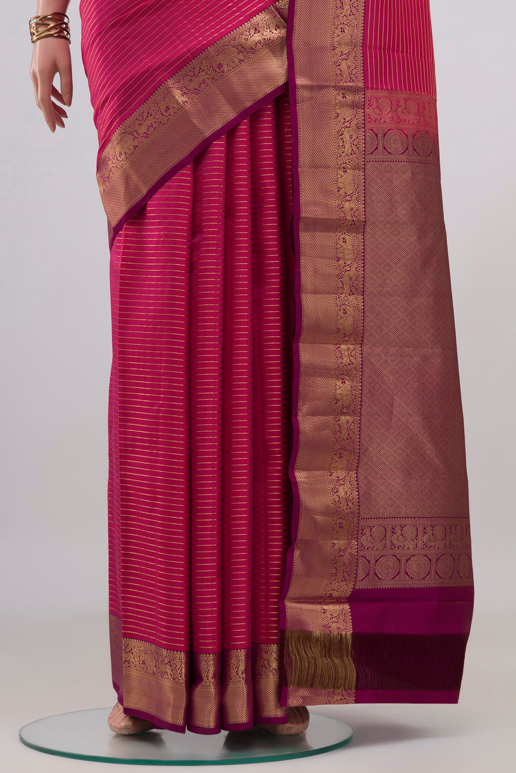 Pleats and pallu of Pink Kanjivaram Silk Saree with Stripes on the body and Zari Border. 