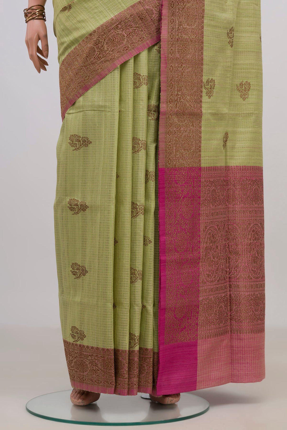 Pleats and pallu of Pure Silk Light Green Banarasi Tussar Saree with Zari Butta on the body and Fancy Border. 