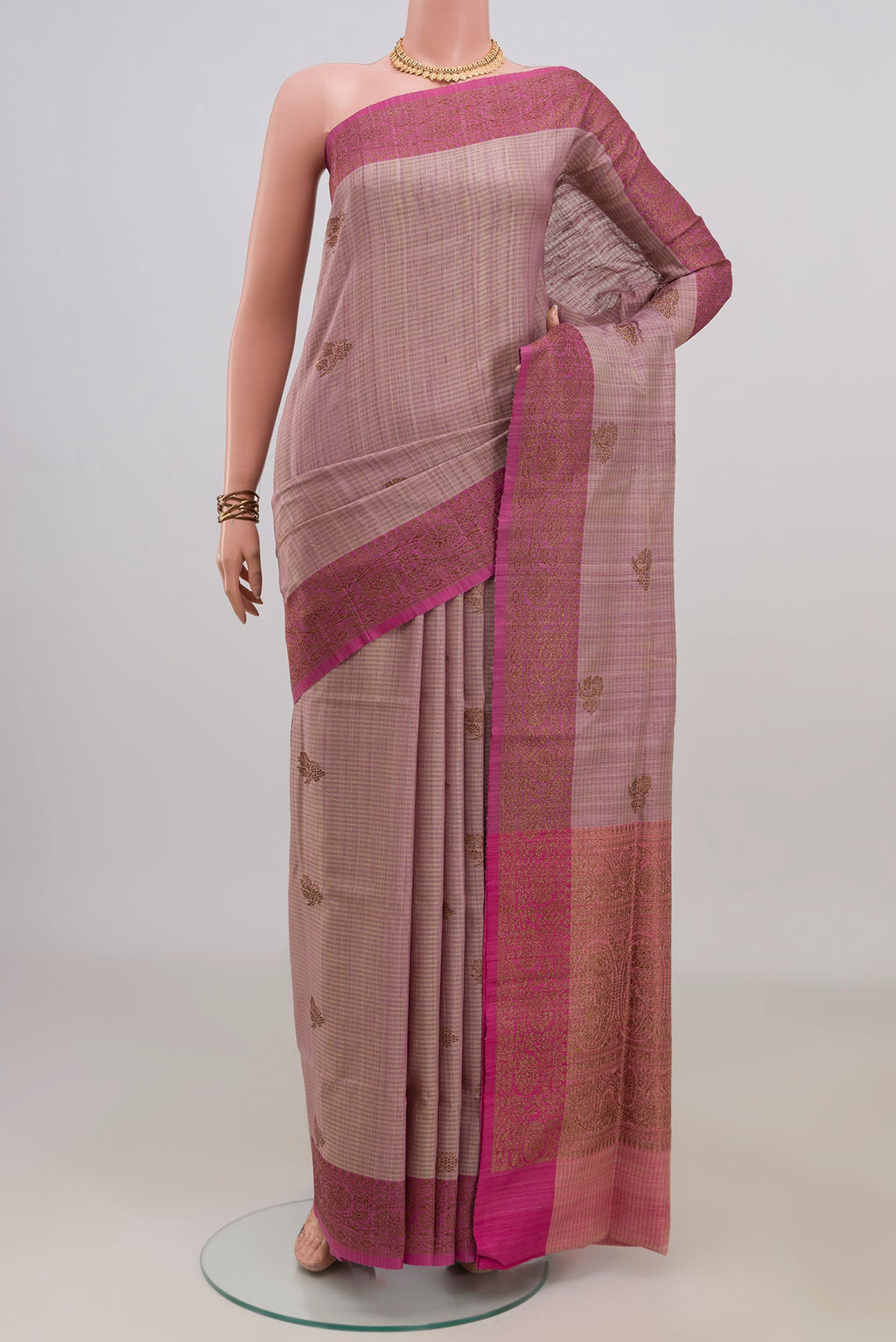 Pure Silk Lavender Banarasi Tussar Saree with Zari Butta on the body and Fancy Border.  displayed on a mannequin