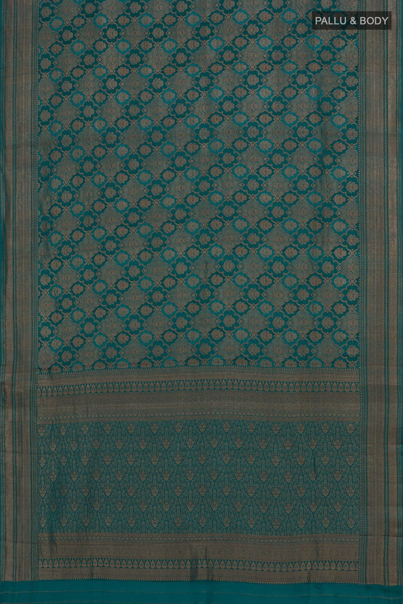 Flat view of Teal Crepe Saree with Zari Brocade on the body and Zari Border. 