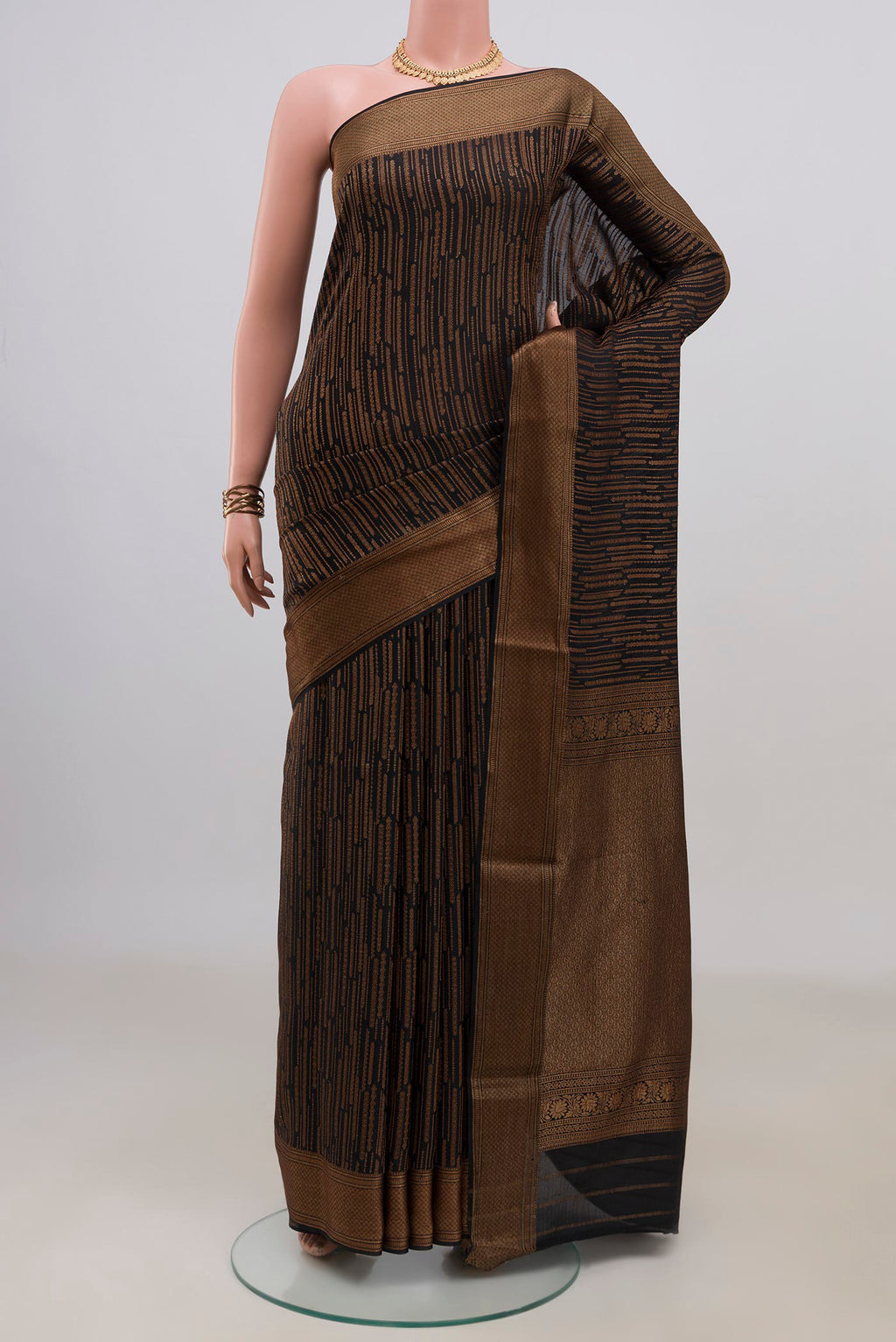 Black Mysore Crepe Saree with Stripes on the body and Zari Border.  displayed on a mannequin