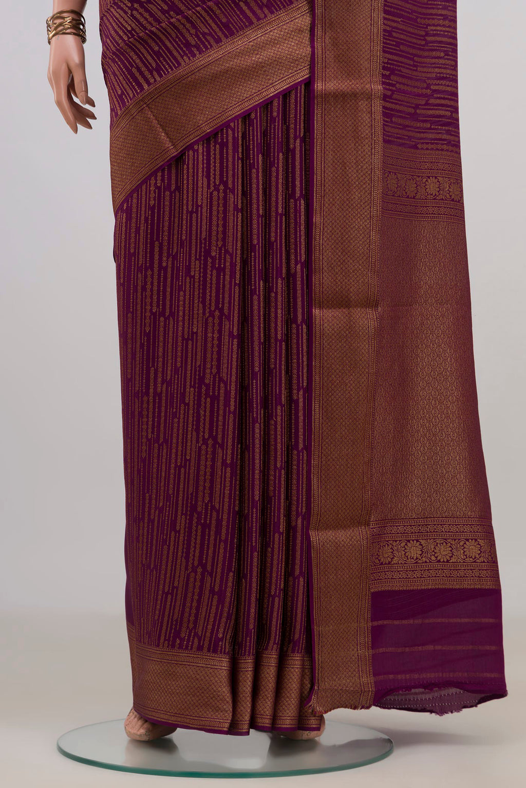 Pleats and pallu of Purple Mysore Crepe Saree with Stripes on the body and Zari Border. 