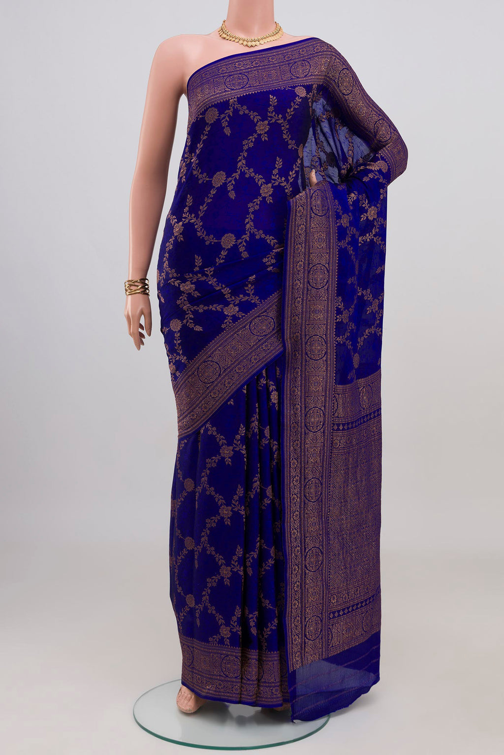Royal Blue Crepe Saree with Zari Brocade on the body and Fancy Border.  displayed on a mannequin