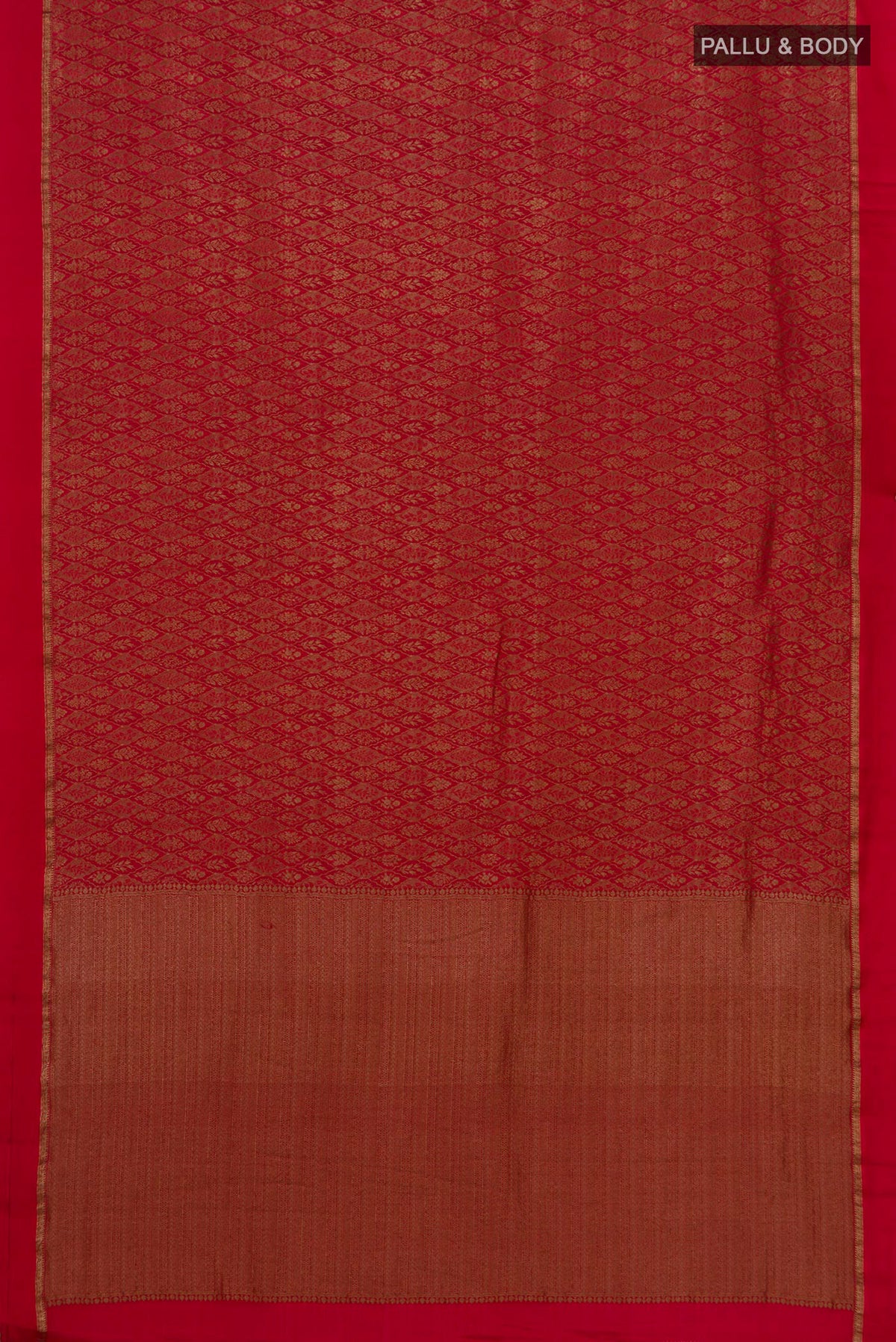 Flat view of Red Crepe Saree with Zari Brocade on the body and Thin Zari Line. 