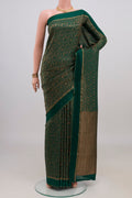 Bottle Green Mysore Crepe Saree with Zari Brocade on the body and Thin Zari Line.  displayed on a mannequin