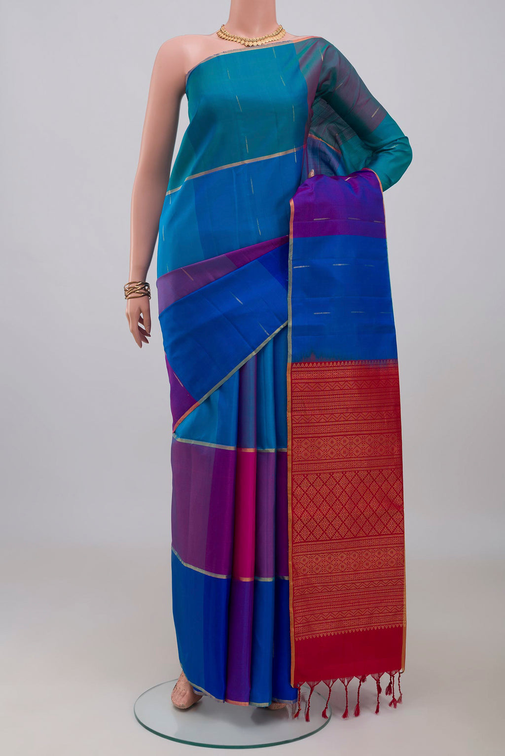 Multi Color Soft Silk Saree with Zari Butta on the body and Thin Zari Line.  displayed on a mannequin