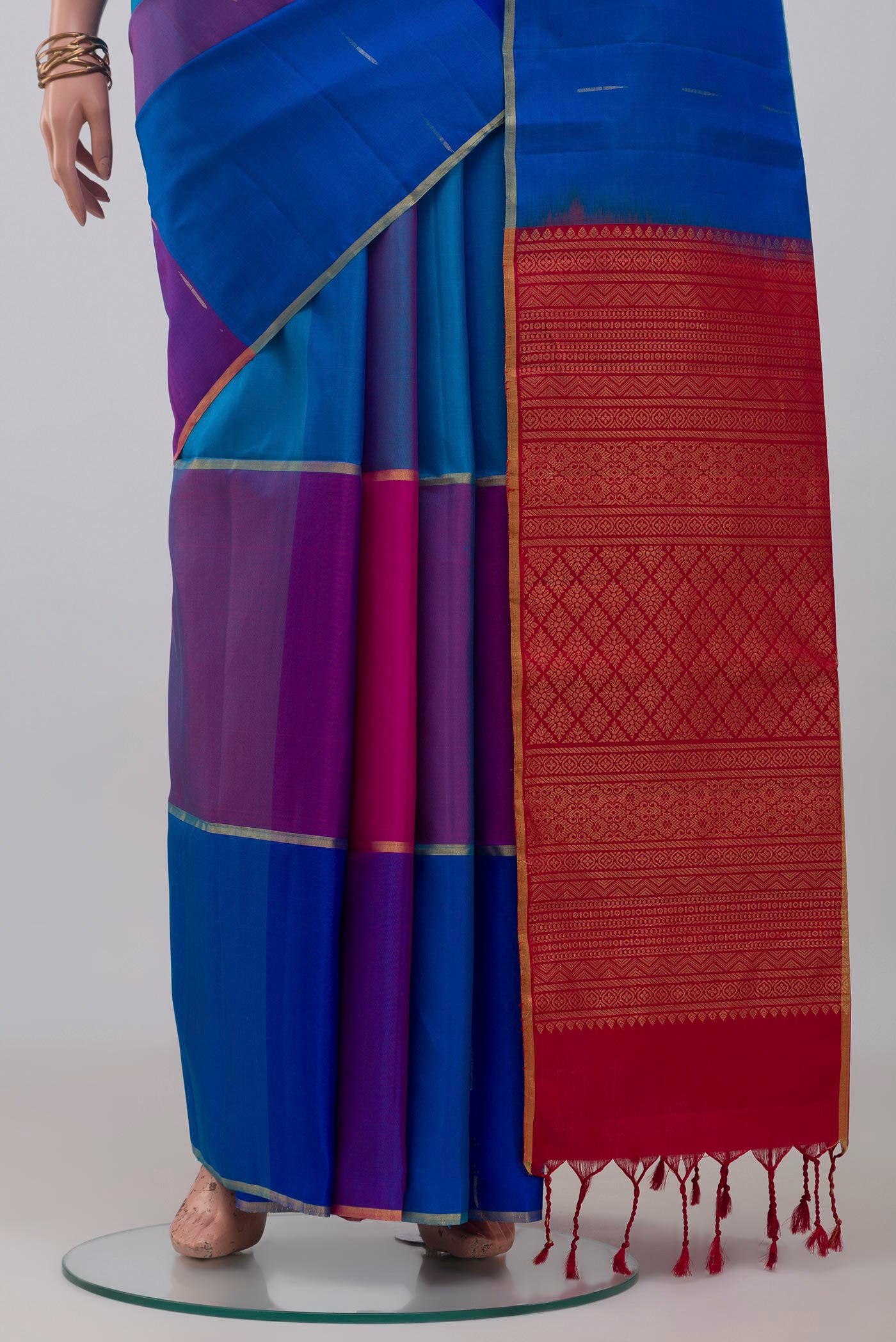 Pleats and pallu of Multi Color Soft Silk Saree with Zari Butta on the body and Thin Zari Line. 