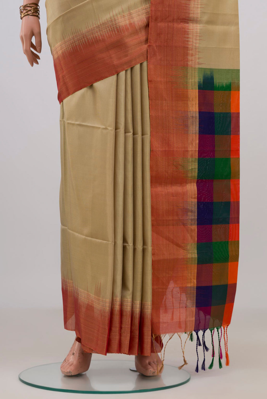 Pleats and pallu of Pure Silk Beige Soft Saree with Plain Body and Zari Border. 