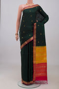 Bottle Green Soft Silk Saree with Zari Butta on the body and Zari Border.  displayed on a mannequin