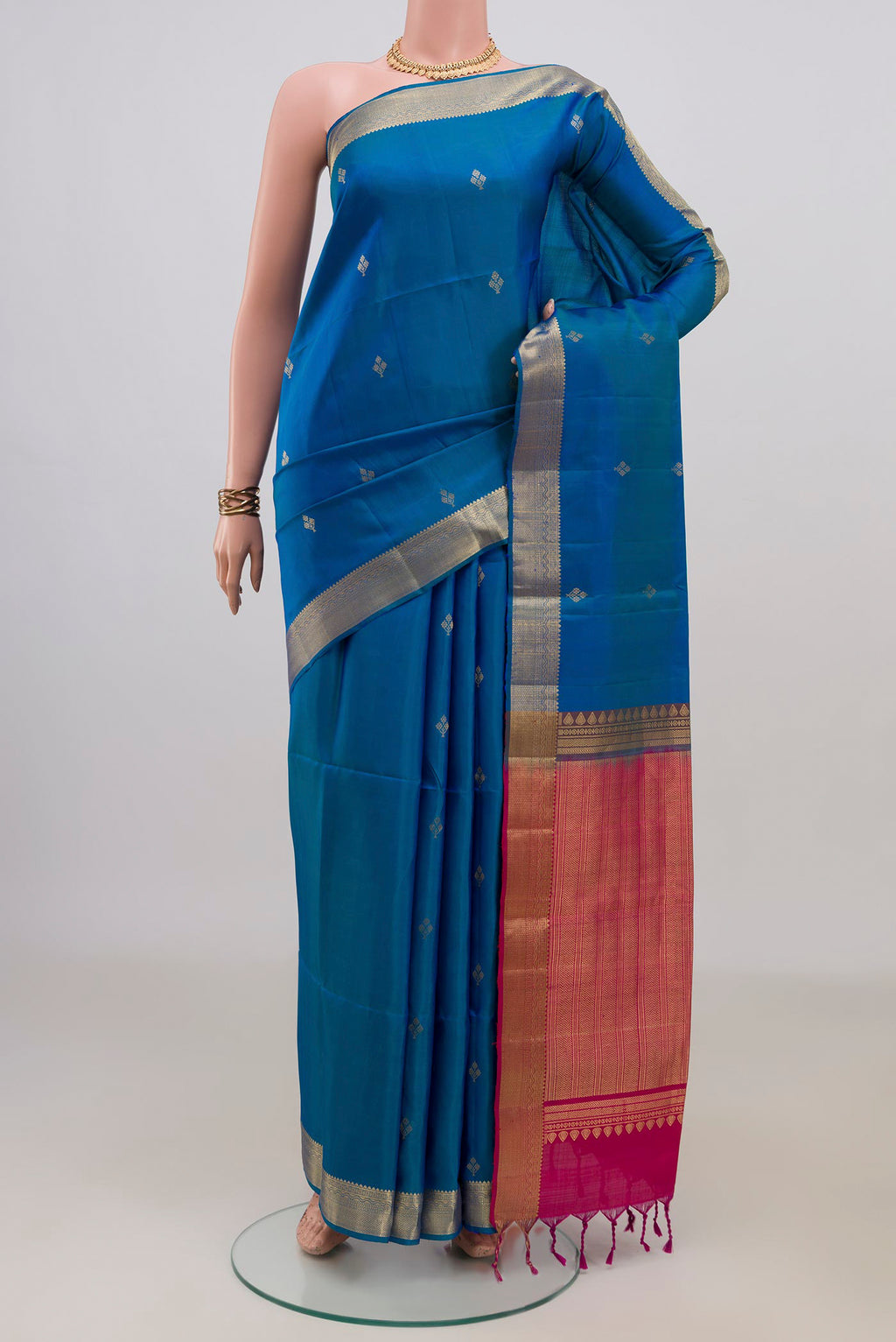 Pure Silk Blue Soft Saree with Zari Butta on the body and Zari Border.  displayed on a mannequin