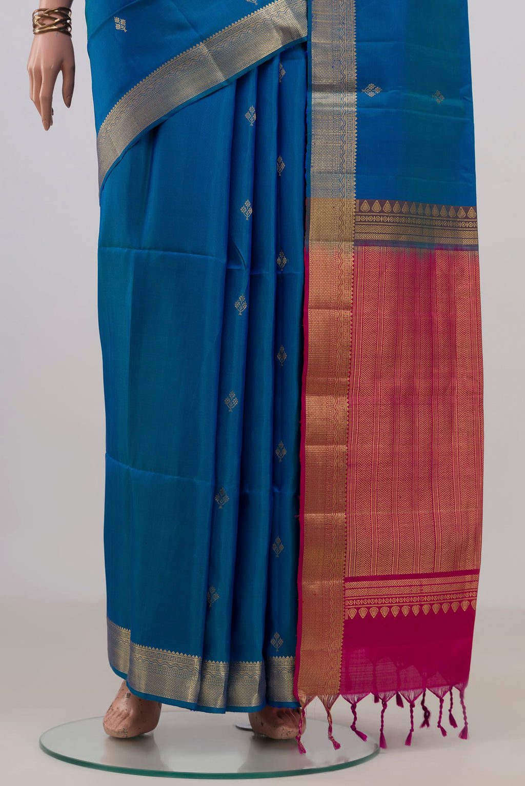 Pleats and pallu of Pure Silk Blue Soft Saree with Zari Butta on the body and Zari Border. 