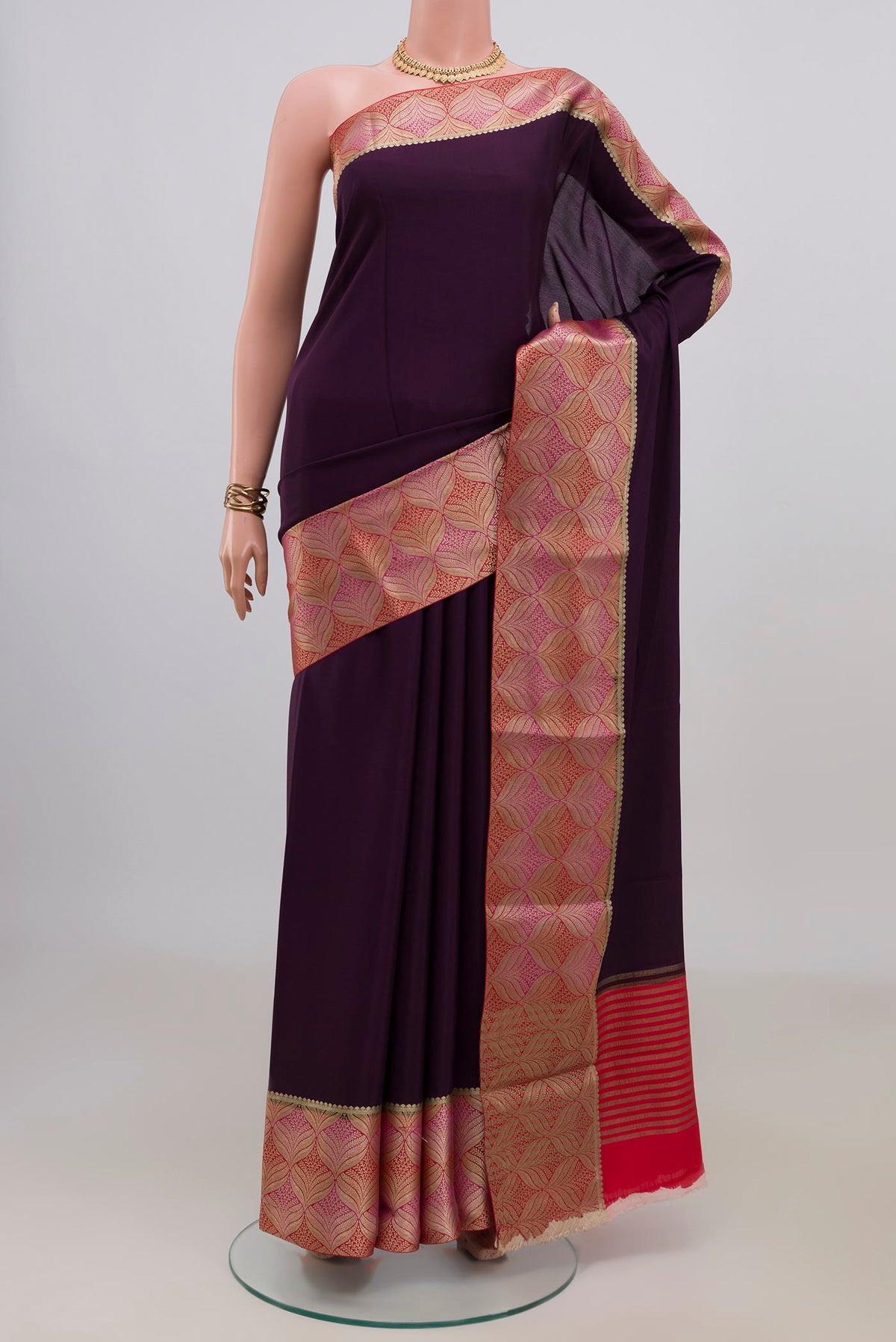 Purple Mysore Crepe Saree with Plain Body and Fancy Border.  displayed on a mannequin
