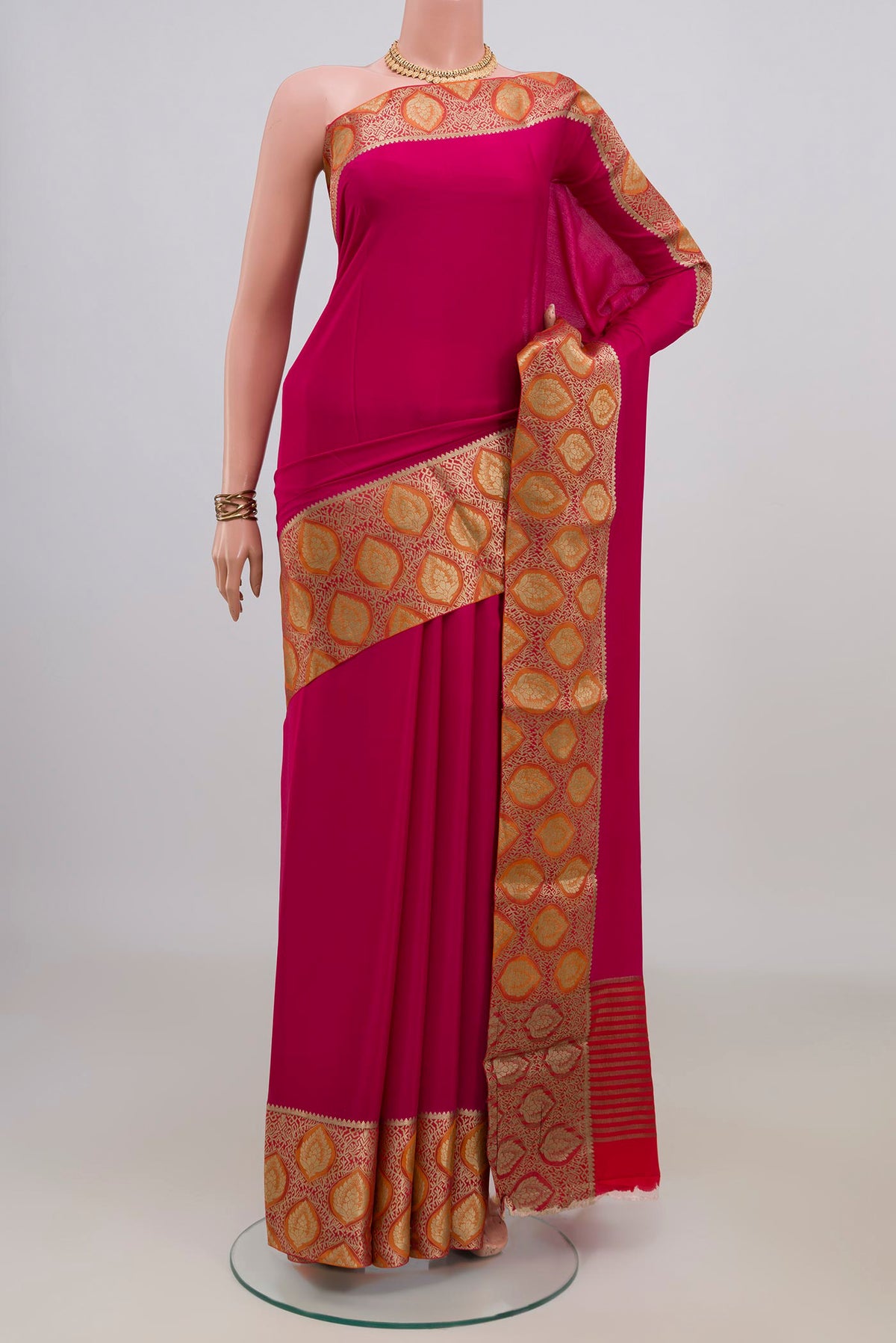 Pink Mysore Crepe Saree with Plain Body and Fancy Border.  displayed on a mannequin